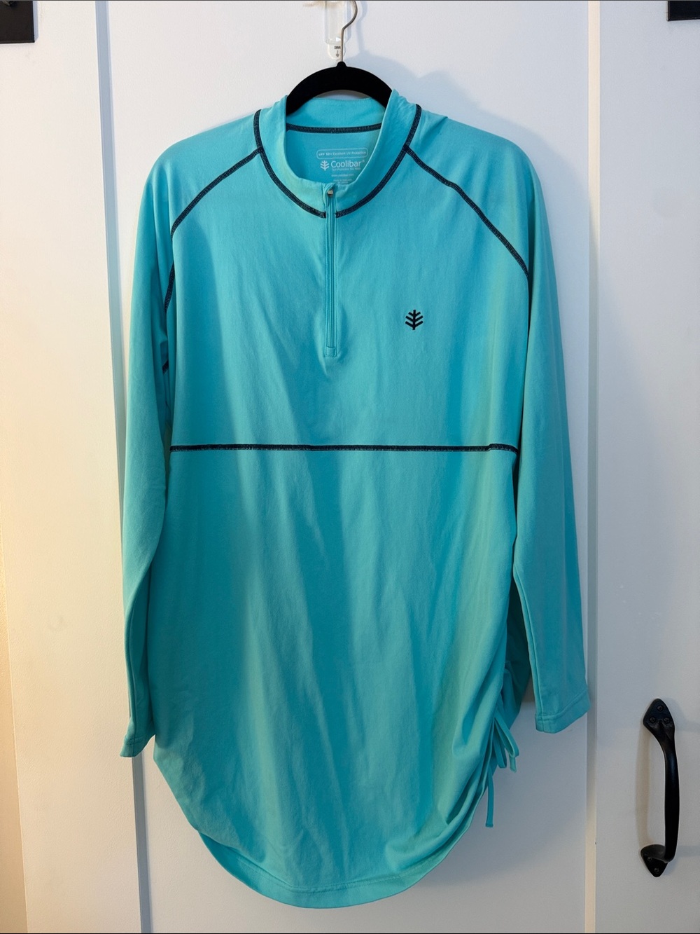 Coolibar Women’s Long-Sleeve Swim Rash Guard in Aqua with Black Trim